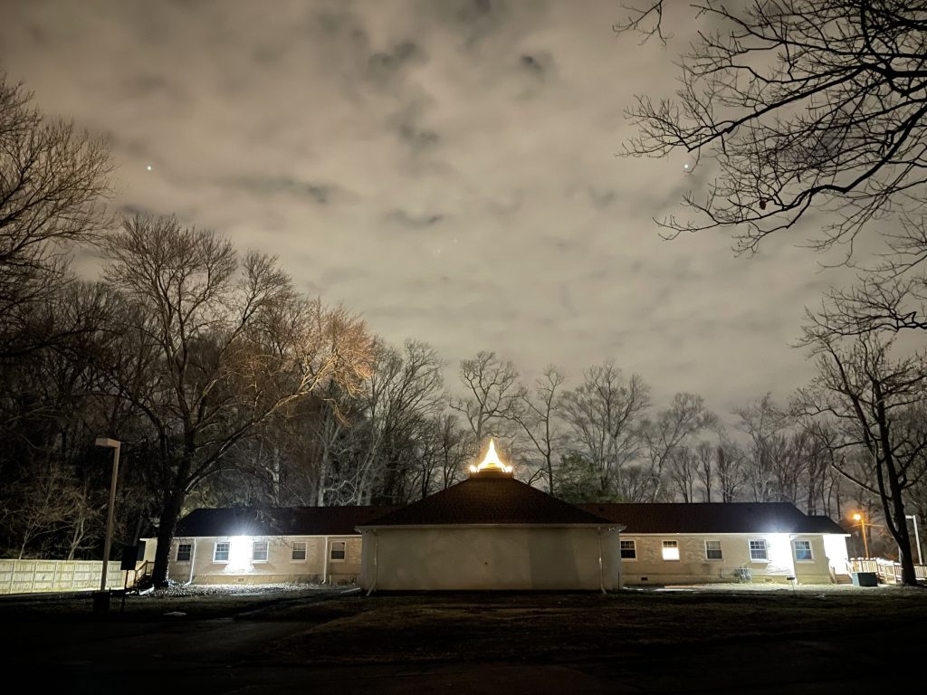 Night view of Building 3 with the zedi lit.